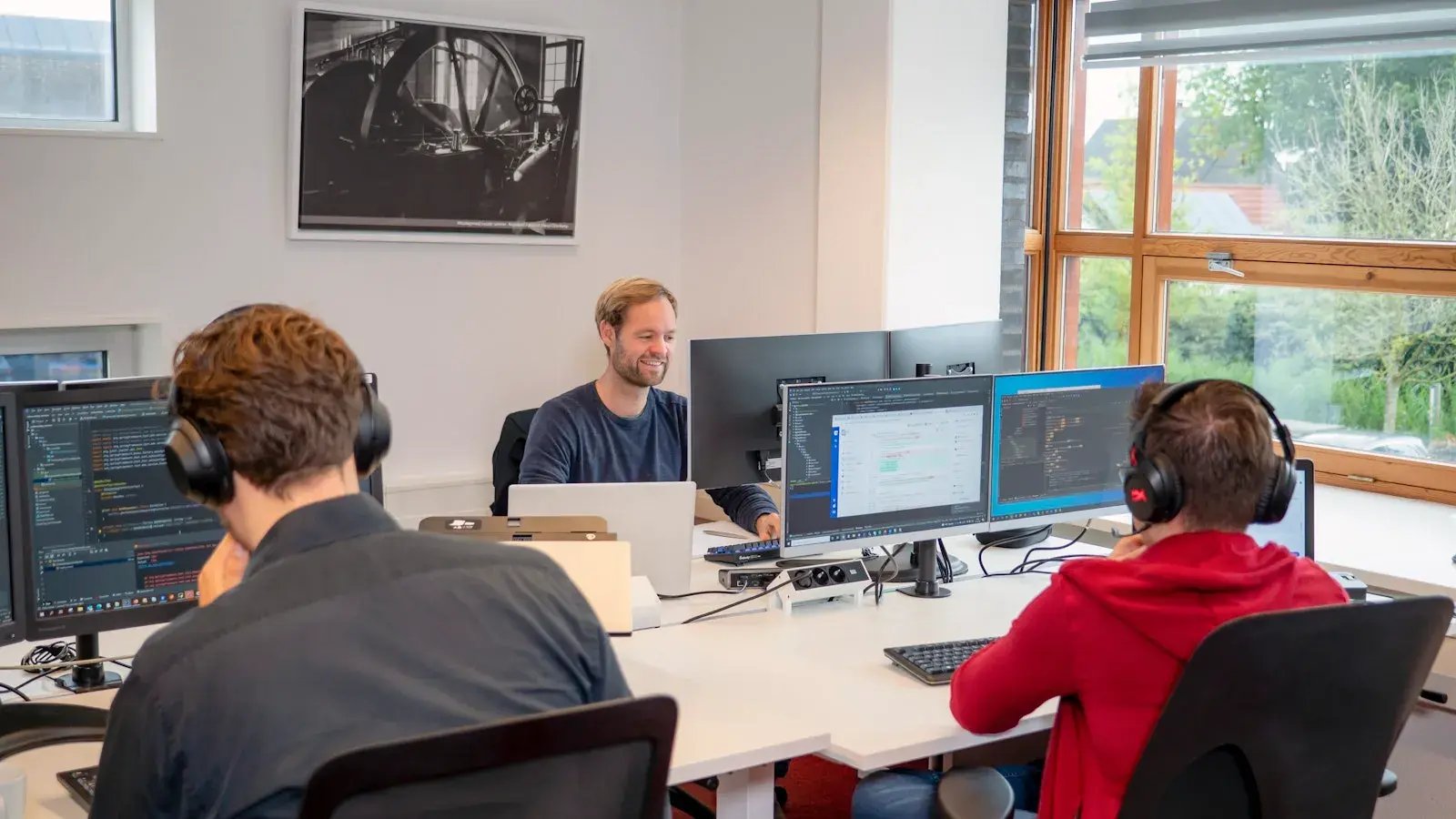 Data engineers working behind their desks