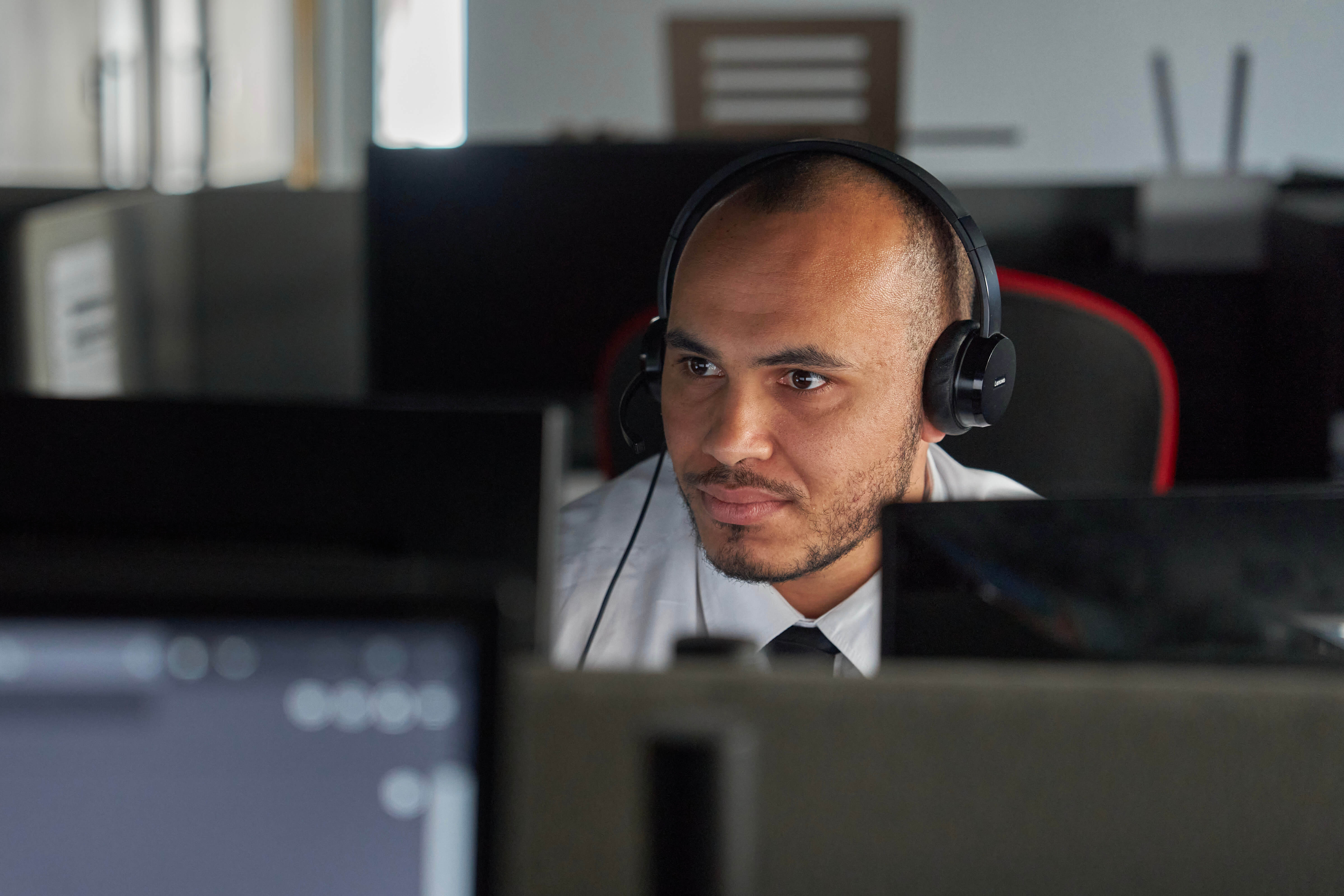 Man behind computer in full concentration